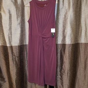 Sleeveless purple dress.